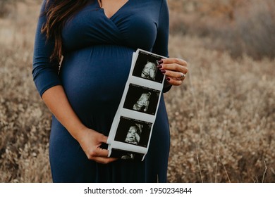 Pregnancy Announcement With Ultrasound In A Field 