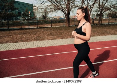 Pregnancy Fitness. Prenatal Healthy Fitness Active Fit Gym Outside. Pregnant Woman Training Yoga Sport Exercise. Prenatal Gymnastics