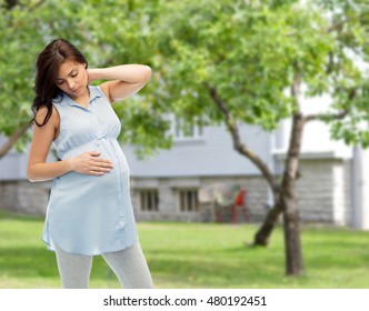 Pregnancy, Health, People And Expectation Concept - Pregnant Woman Touching Her Neck And Suffering From Ache Over Summer Garden And House Background