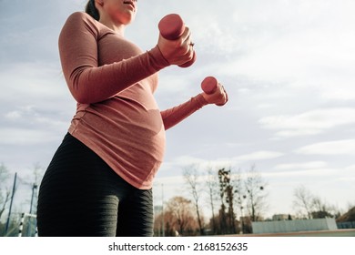 Pregnancy health. Prenatal healthy fitness active fit gym outside. Pregnant woman training yoga sport exercise. Pregnancy yoga exercise