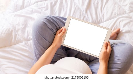 Pregnancy mockup digital tablet. Pregnant woman holding smart tablet. Mobile pregnancy online maternity application mock up. Concept maternity, pregnancy, childbirth - Powered by Shutterstock