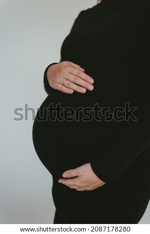 Similar – Image, Stock Photo Pregnant woman holding her tummy