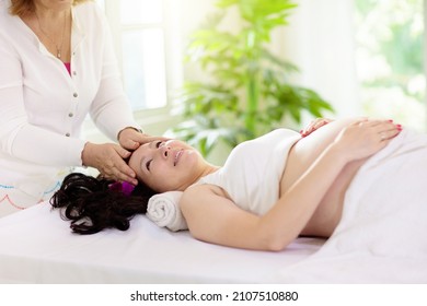 Pregnancy Spa Treatment. Massage For Pregnant Woman. Asian Expectant Mom Enjoying Wellness Day. Relax And Meditation. New Mom Relaxing In Health Care Clinic. Pampering Time For Expecting Mother.