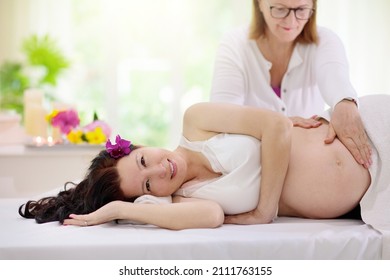 Pregnancy Spa Treatment. Massage For Pregnant Woman. Asian Expectant Mom Enjoying Wellness Day. Relax And Meditation. New Mom Relaxing In Health Care Clinic. Pampering Time For Expecting Mother.