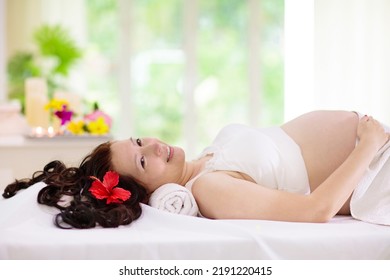 Pregnancy Spa Treatment. Massage For Pregnant Woman. Asian Expectant Mom Enjoying Wellness Day. Relax And Meditation. New Mom Relaxing In Health Care Clinic. Pampering Time For Expecting Mother.