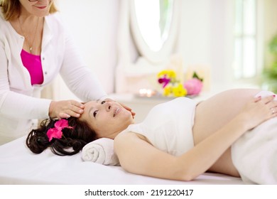 Pregnancy Spa Treatment. Massage For Pregnant Woman. Asian Expectant Mom Enjoying Wellness Day. Relax And Meditation. New Mom Relaxing In Health Care Clinic. Pampering Time For Expecting Mother.