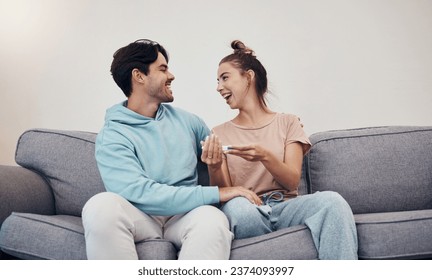 Pregnancy test, happy and couple in home living room, reading good news or check results. Kit, excited man and pregnant woman or mother smile on sofa for success, future maternity or ivf fertility - Powered by Shutterstock