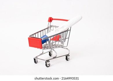 Pregnancy Test In A Shopping Cart On White Background Close Up