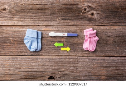 Pregnancy. While It Is Not Known There Will Be A Boy Or A Girl. Still Life On Wooden Boards.