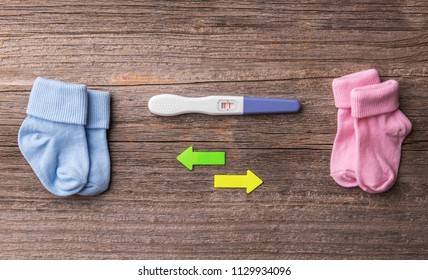 Pregnancy. While It Is Not Known There Will Be A Boy Or A Girl. Still Life On Wooden Boards.