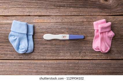 Pregnancy. While It Is Not Known There Will Be A Boy Or A Girl. Still Life On Wooden Boards.