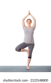 Pregnancy Yoga Exercise - Pregnant Woman Doing Asana Vrikshasana - Tree Pose Isolated On White Background