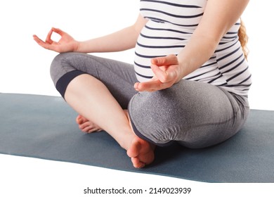 Pregnancy yoga exercise - pregnant woman doing asana Sukhasana with chin mudra easy yoga pose isolated on white background