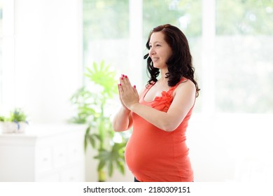 Pregnancy Yoga. Exercise For Pregnant Woman. Active Asian Female Exercising At Home Or Gym. New Expectant Mom Keeping Active And Fit Before Childbirth. Sport For Expecting Mother. Online Class.