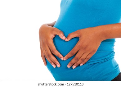 pregnant african american woman hands on belly forming a heart shape