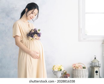 Pregnant Asian Woman Concept. Maternity Photography.