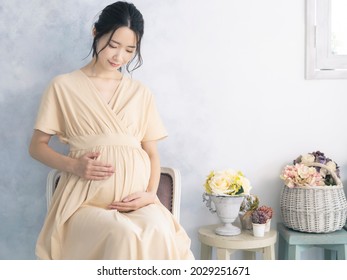 Pregnant Asian Woman Concept. Maternity Photography.