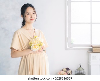 Pregnant Asian Woman Concept. Maternity Photography.