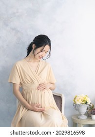 Pregnant Asian Woman Concept. Maternity Photography.