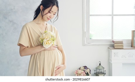 Pregnant Asian Woman Concept. Maternity Photography.