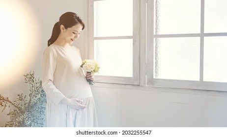 Pregnant Asian Woman Concept. Maternity Photography.