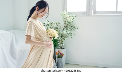 Pregnant Asian Woman Concept. Maternity Photography.