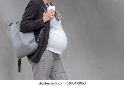 Pregnant business woman before the birth