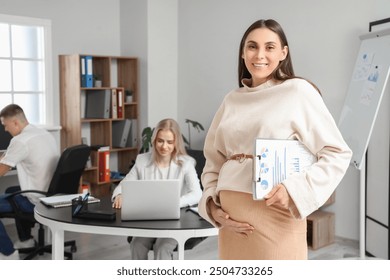 Pregnant businesswoman with clipboard in office - Powered by Shutterstock