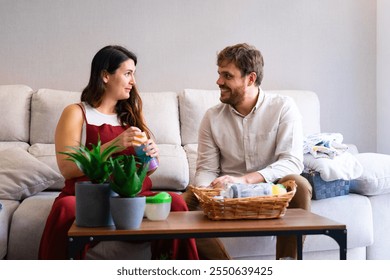 Pregnant Caucasian couple preparing future baby things at home - Powered by Shutterstock