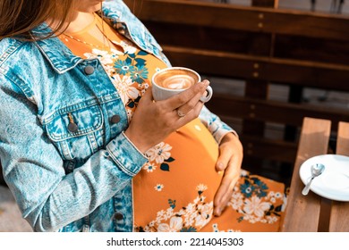 Pregnant coffee drink woman. Happy pregnancy girl drink hot coffee in restaurant. Represent breakfast for energy and freshness concept - Shutterstock ID 2214045303