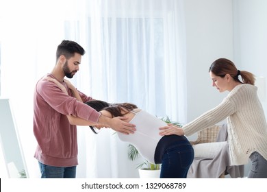 Pregnant Couple With Doula At Home