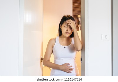 Pregnant Female Nausea In Toilet,Hand Woman Touching Her Belly With Morning Sickness