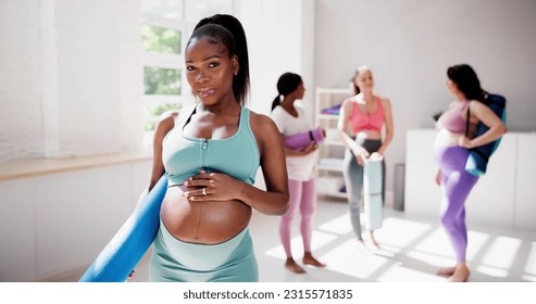 Pregnant Fitness Woman In Yoga Gym. Sport and Exercise - Powered by Shutterstock