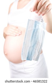 Pregnant Girl Holding A Medical Face Mask