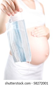 Pregnant Girl Holding A Medical Face Mask