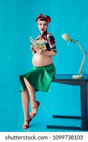 Pregnant girl on bright background in pin-up style
