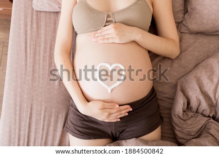 Similar – Pregnant woman embraced by her husband