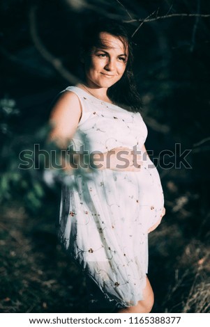 Similar – Unrecognizable pregnant woman showing ultrasound of her baby on the mobile