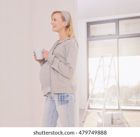 Pregnant Happy Smiling Woman Drinking Herbal Tea