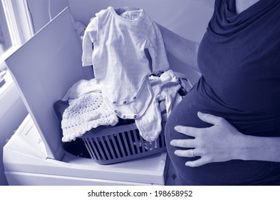 Pregnant Housewife Woman Doing Housework, Washing Family Clothes, During Pregnancy.Concept Photo Of Pregnancy, Pregnant Woman Lifestyle And Health Care.