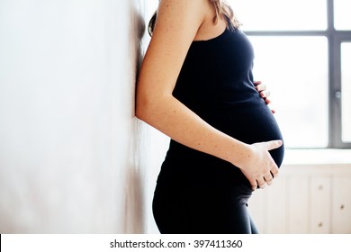 Pregnant lady in black yoga clothes 