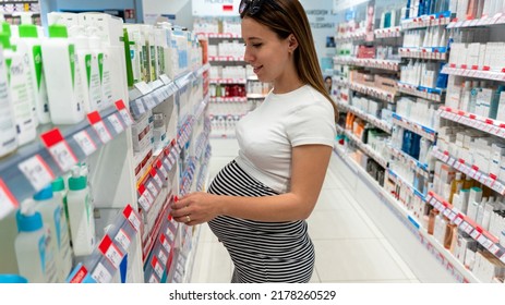 Pregnant Medicine Pharmacy Woman. Young Pregnancy Female Customer In Retail Health Drug Store. Therapy, Healthcare, Motherhood Concept