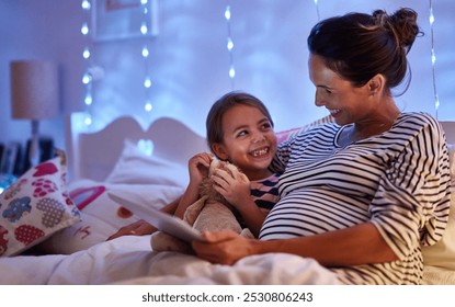 Pregnant mother, daughter or bed with tablet at night for story, online reading or ebook at home. Mom, little girl or child with smile in bedroom for late evening entertainment or novel on technology - Powered by Shutterstock