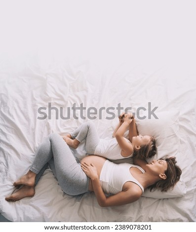 Similar – Young adult couple kissing each other on couch