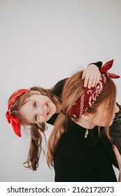 Pregnant Mother With Her Preschool Daughter Having Fun In Matching Outfits 