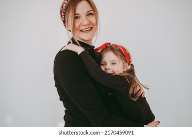 Pregnant Mother With Her Preschool Daughter Having Fun In Matching Outfits 