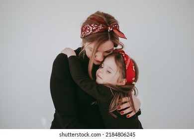 Pregnant Mother With Her Preschool Daughter Having Fun In Matching Outfits 