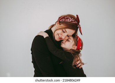 Pregnant Mother With Her Preschool Daughter Having Fun In Matching Outfits 