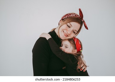 Pregnant Mother With Her Preschool Daughter Having Fun In Matching Outfits 