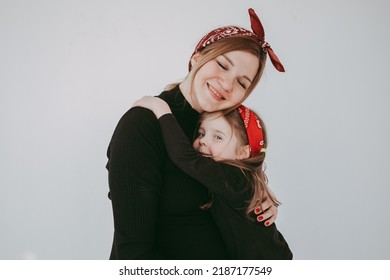 Pregnant Mother With Her Preschool Daughter Having Fun In Matching Outfits . High Quality Photo